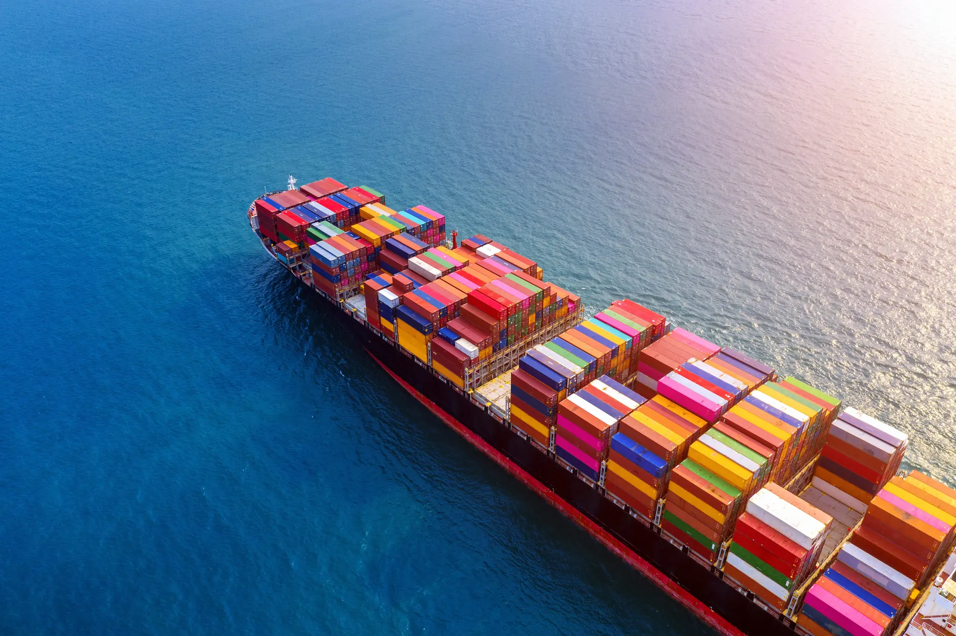 Aerial view of a loaded container ship at sea