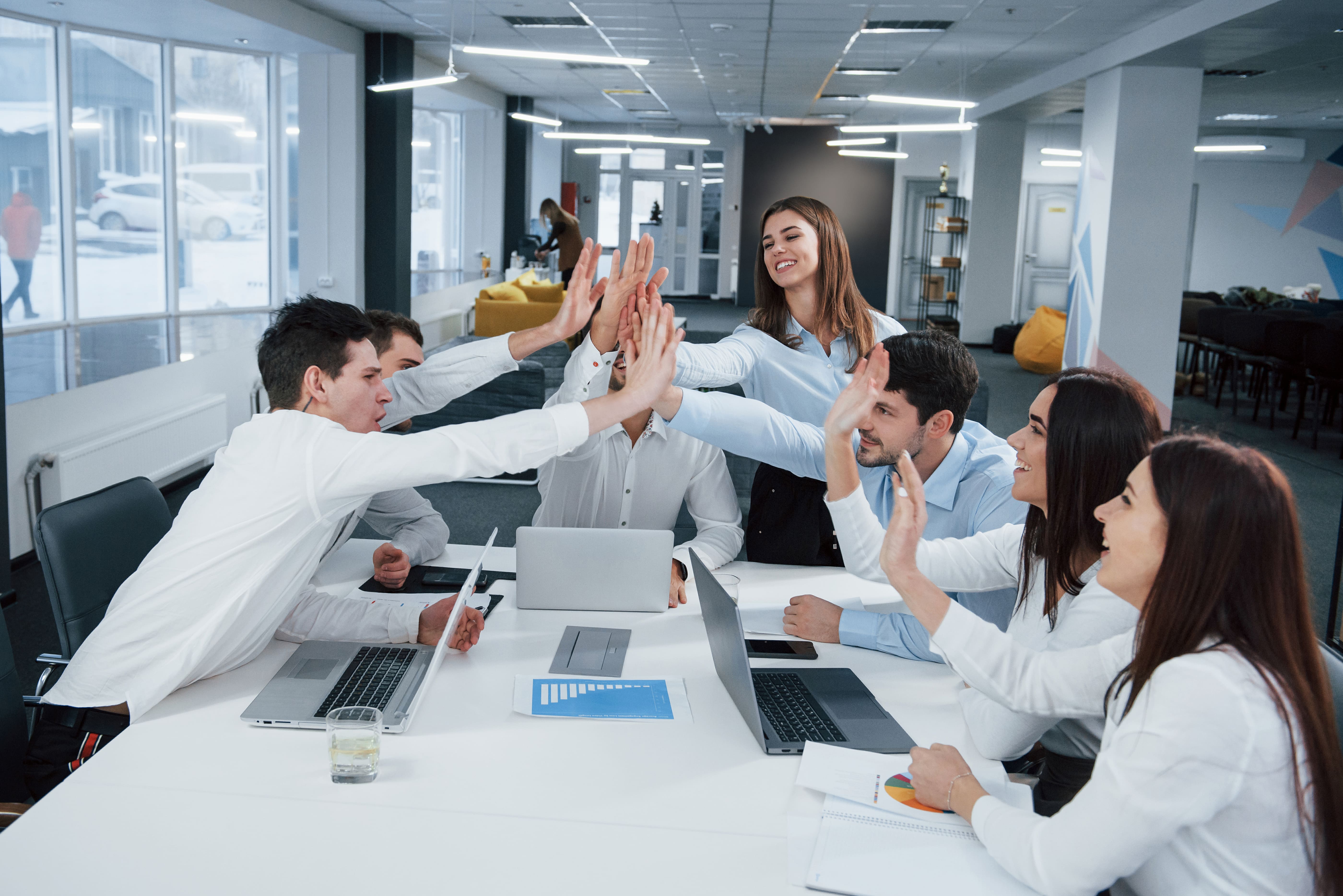 A team celebrating a successful Odoo implementation